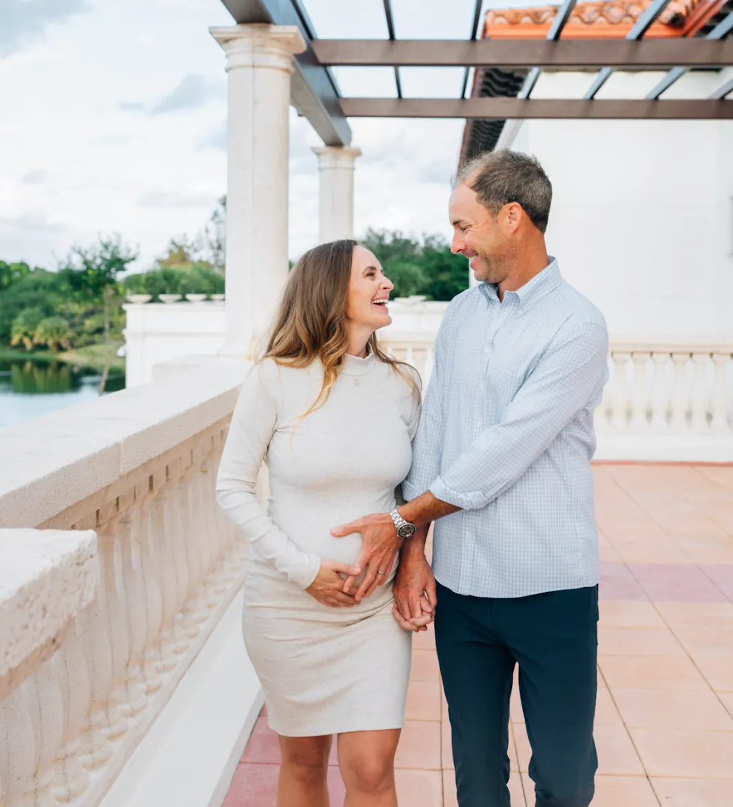 Maren with her husband - hands on baby bump