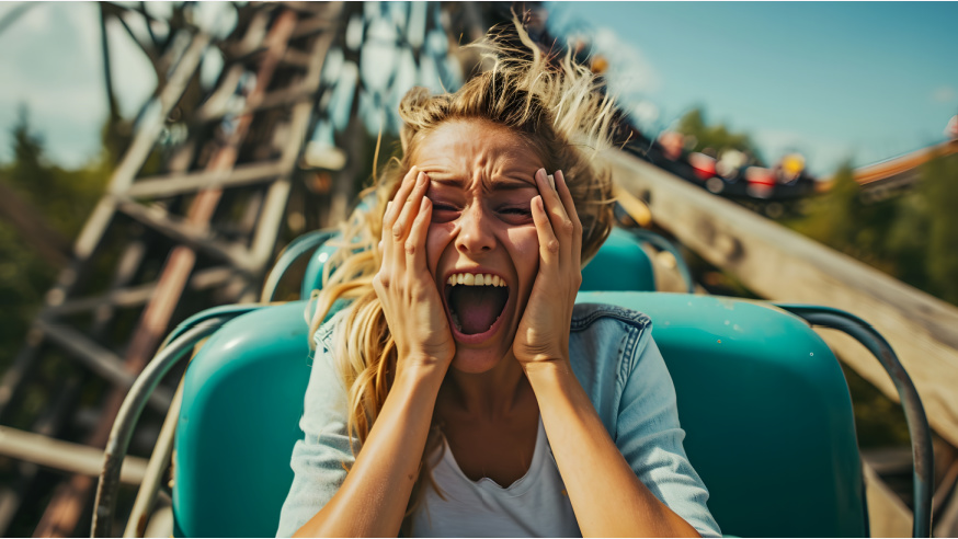 scared woman on roller coaster